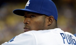 Los Angeles Dodgers right fielder Yasiel Puig watches from the dugout during a game against the San Francisco Giants. Photograph: Kirby Lee/USA Today Sports
